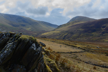 stone infront of mountains 