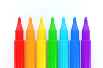 Set of colorful markers arranged in a rainbow gradient from red to purple on a white background. Bright and vibrant stationery concept for art, education, or creative design projects