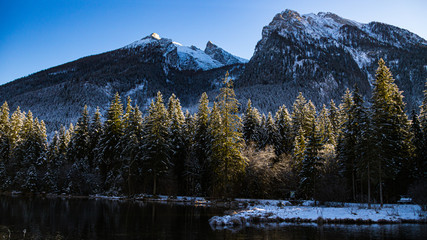 Beautiful winter landscape with reflections at the famous Hintersee, Ramsau, Berchtesgaden,...