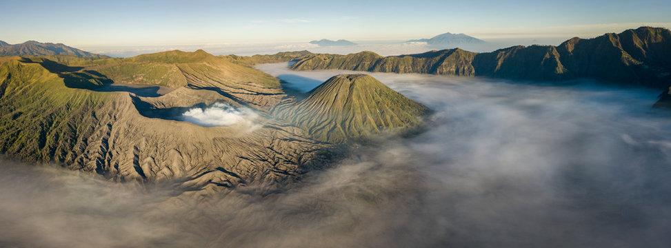 Indonesia, East Java, Aerial panorama of Mount Bromo shrouded in morning fog