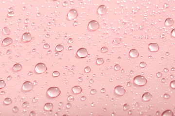 Water drops on pink background