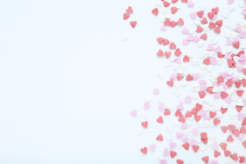 Heart shaped sprinkles on white background