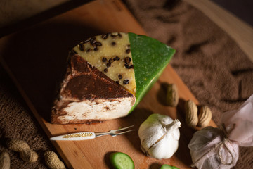 different slicing cheeses Handmade cheese on a wooden board delicious treats foodfotos foodphoto