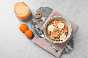 Tasty healthy breakfast served on light grey table, flat lay