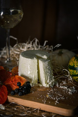 different slicing cheeses Handmade cheese on a wooden board delicious treats foodfotos foodphoto