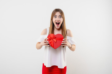 pretty woman with red heart shaped valentine gift box isolated on white background