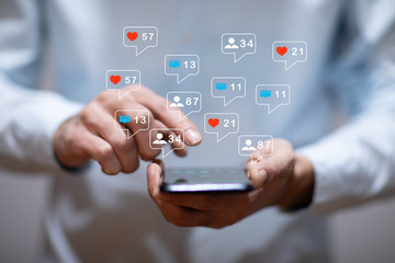 man hand using smartphone with colorful application icons around