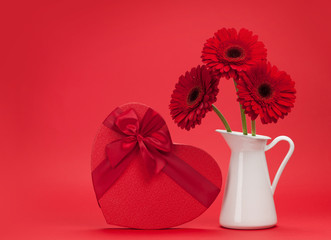 Valentines day greeting card with gerbera and gift