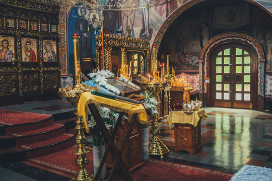Church ordinance orthodox and wedding, church wedding, religious of a child in church, icons, Orthodox church, candles, interior of the Orthodox Church, bible, font