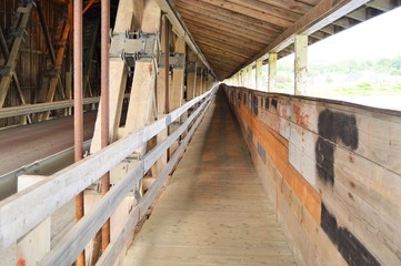 The walkway inside the covered bridge at Hardford for people to walk across.