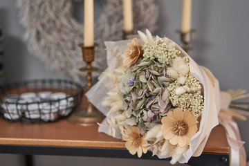 bouquet of dried flowers. Still life with wheat ears and yellow wildflowers.