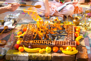 Indian wedding ritual, beautiful bonfire decorated with fruit.