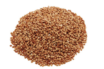 The buckwheat is scattered on a white background isolated.