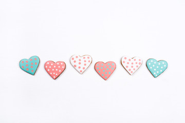 Gingerbread cookies with frosting in the shape of a heart. Valentines day concept. Flat lay, top view.