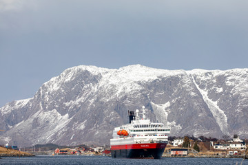 Coastal passenger ship arrives at Bronnoysund harbor, in northern Norway