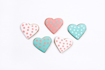 Gingerbread cookies with frosting in the shape of a heart. Valentines day concept. Flat lay, top view.