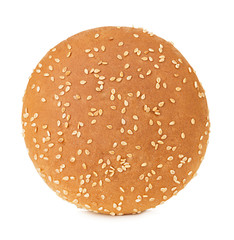 Burger bun with sesame seeds isolated on white background with clipping path.