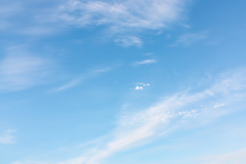 Light cirrus clouds in the blue sky on a sunny day, full frame image, background