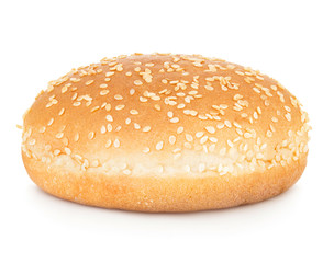 Burger bun with sesame seeds isolated on white background with clipping path.