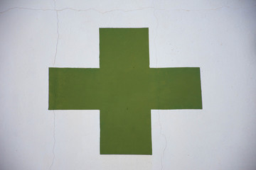 Fototapeta premium Hospital or pharmacy sign painted on a white wall