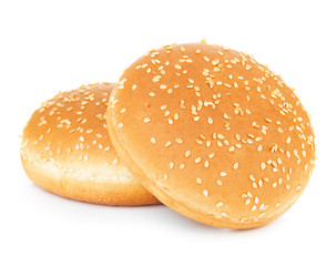 Two sandwich bun with sesame seeds isolated on white background.