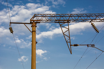 High-voltage power lines above the railroad. Railway wires.