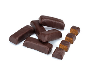 Chocolate candies and their pieces isolated on white