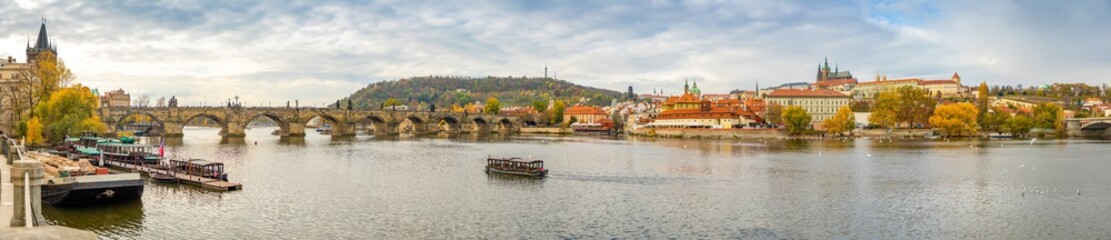 Fototapeta na wymiar Panorama view of Prague Castle and Charles bridge over river Vltava in november day, Prague, Czech Republic