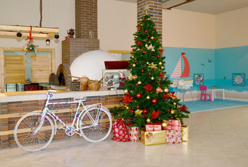 KALININGRAD, RUSSIA - DECEMBER 26, 2019: New Year tree and a bicycle near the bar. Interior of a modern cafe