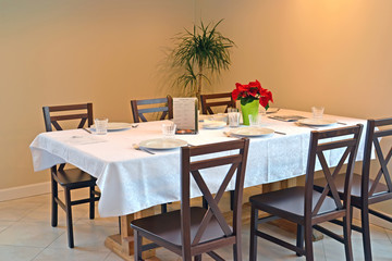 Table for six in the cafe interior