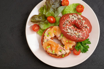 red bagel with salmon pate and smoked salmon