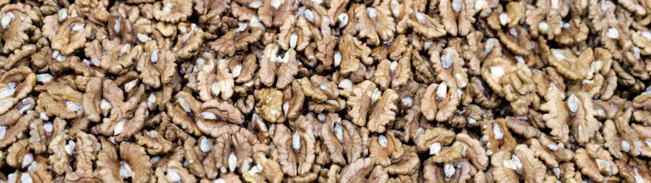 Walnuts shelled. Peeled Raw Walnuts. Fresh organic Nuts. Raw nuts. Many delicious Walnuts as a food background.