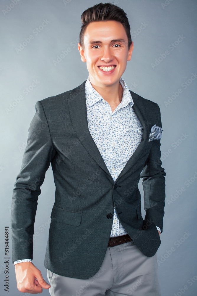 Wall mural young pretty businessman posing emotional gesturing on white background, lifestyle people concept