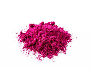 Dragon fruit powder heap isolated on white with clipping path. Perfect bright magenta freeze dried pitahaya cactus or Hylocereus costaricensis powder