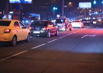 Fototapeta na wymiar car driving on evening city
