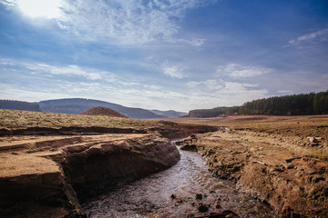 The bottom of the empty Studena dam near Pernik, Bulgaria. Hot weather and climate changes makes the dam almost empty. November 2019. Climate disaster.
