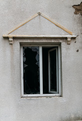 Acts of vandalism, broken windows in an abandoned building