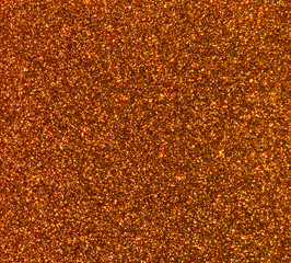 Bright trendy gold background with glitter.