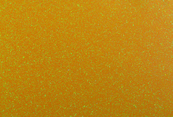 Bright trendy gold background with glitter.