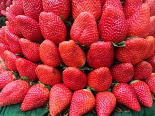pile of strawberries stacked together