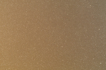 Bright trendy brown background with glitter.