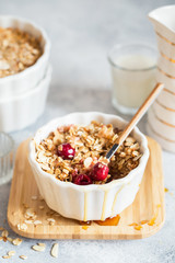 Cherry and Apricot crumble pie. Fruit Crumble with Any Kind of Fruit. Dessert with fruits, oatmeal and almonds. Berry cake, crisp in baking dish. Crispy cake