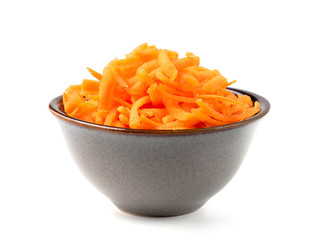 Fresh organic shredded carrots in small white bowl. Raw grated carrots isolated on white with clipping path.