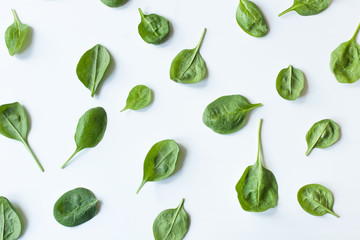 Fresh spinach leaves isolated on white top view. Vegetable pattern design. Copy space. flat lay