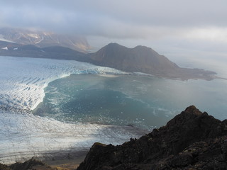 View of the front of the Hans Glacier and the bay of Hansbukta.  (Europe, Svalbard, Hornsund.)