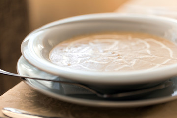 Tasty pumpkin cream soup closeup
