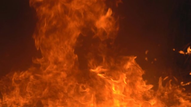 Slow motion fire concept, Fire flame close up  burning super Slow motion.It real fire flame on campfire is rapid oxidation material in exothermic chemical process of combustion releasing heat light