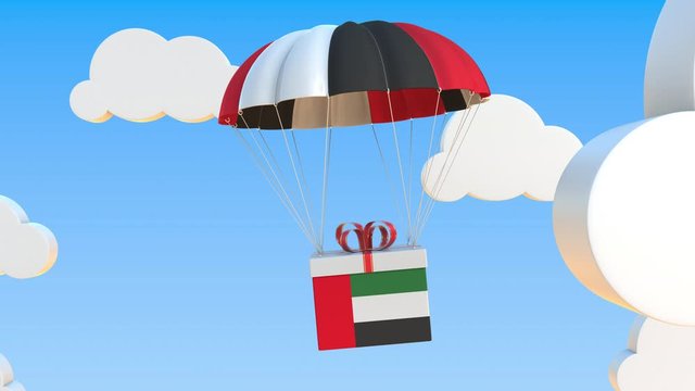 Carton with flag of the United Arab Emirates UAE falls with a parachute. Loopable conceptual 3D animation