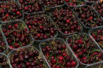sale of sweet cherries in the grocery market