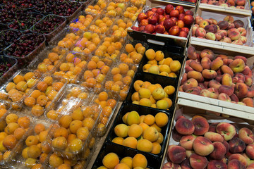 sale of apricot, nectarine, sweet cherries in the grocery market